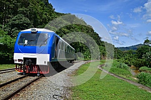 Train transportation service in rural tropical areas with river next to the rail track