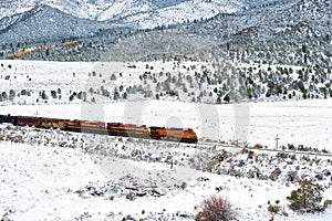 Train transporting tank cars. Season changing autumn to winter.