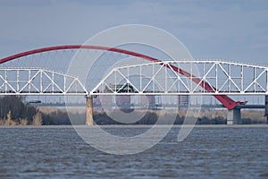 The train is traveling along the railway bridge photo