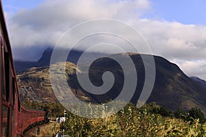 Train travelling towards Ben Nevis, Scotland photo