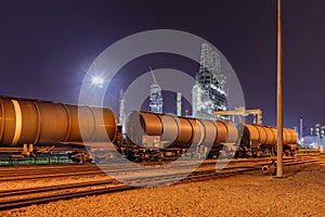 Train wagons at an oil refinery at night, Port of Antwerp, Belgium