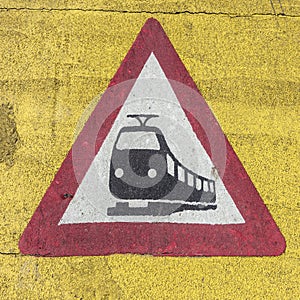 Train warning sign at a railroad crossing