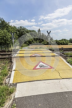 Train warning sign at a railroad crossing
