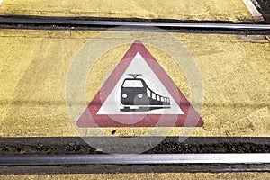 Train warning sign at a railroad crossing