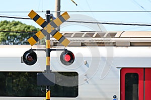 Train warning flashing red lights in Japan that indicate a train is approaching and drivers must stop.