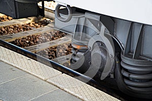Train wheel close-up with large spring