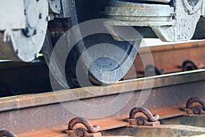 Train wheel close up on railway track at station