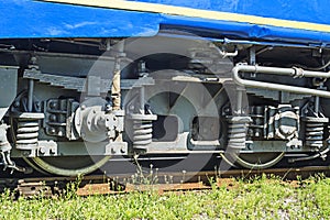 Train wheels on rail track. Wheels of a railway train on rails close up