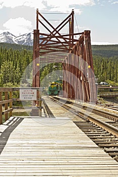 Train and wooden railroad trestle