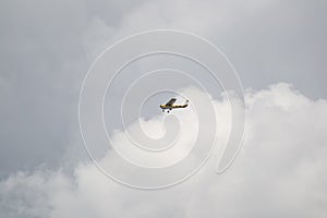 Trainer Cessna Air Craft Flying in the Cloudy Sky