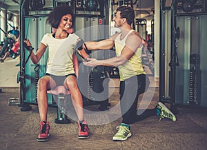 Trainer explaining how to use training machine