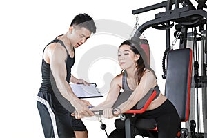 Trainer guiding his client to train on studio