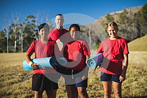 Trainer and kids standing together in the boot camp