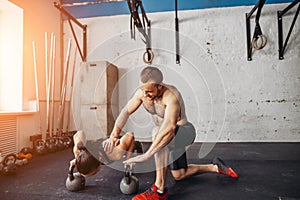 Trainer man and woman push-up strength pushup in a fitness workout