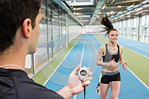 Trainer timing woman on the track