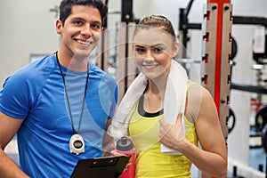 Trainer and woman discussing workout plan