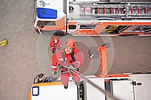 training in altitude rescue at the fire brigade - emergency operation with a crane trolley and abseiling