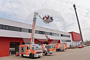 training in altitude rescue at the fire brigade - emergency operation with a crane trolley and abseiling