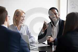 During training diverse employees listening African skilled coach