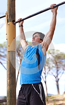 Training, fitness and man on pull up bar with exercise for morning workout, wellness or muscle building in San Francisco