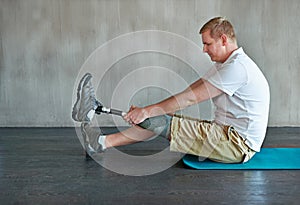 Training, fitness and person with disability in studio for rehabilitation, exercise and physical therapy. Man, strength