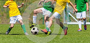 Training and football match between youth teams. Young boys play