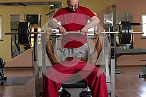 Training in gym where partner gives encouragement