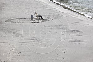 Training a horse on a sand beach. Equestrian sport. Faroe