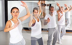 Training man and women in gym in self defense courses