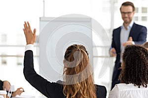 Training participant raise hand ask question at employees team workshop photo
