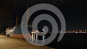 Ship in Riddarfjarden in Stockholm city centre at night in Sweden