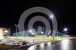 Training soccer field with flood light at night