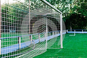 Training soccer field with green turf. Football field with goals and markings or side lines