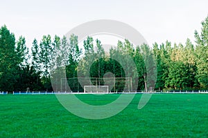 Training soccer field with green turf. Football field with goals and markings or side lines