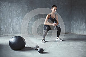 Training. Sports Woman In Fashion Sportswear Doing Squats