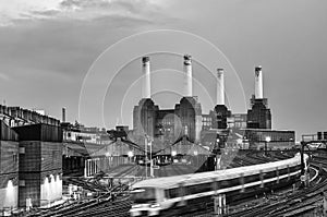 Trains pass Battersea Power Station