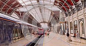 Trains and passengers in Paddington Station, London