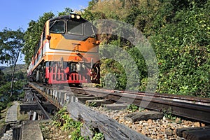 trains running on death railways track crossing kwai river in kanchanaburi thailand this railways important destination of world