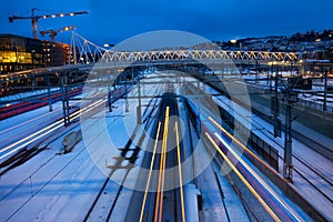 Trains speeding along tracks