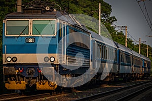 Trains and whistle stop Olesko in central Bohemia in sunset orange evening