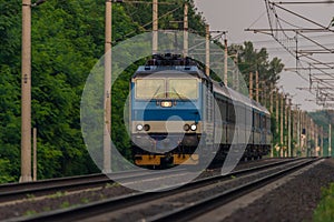 Trains and whistle stop Olesko in central Bohemia in sunset orange evening