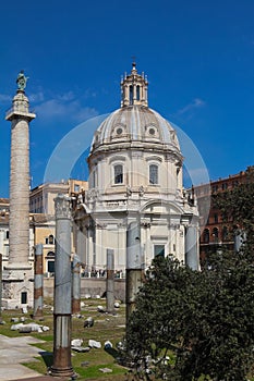 Trajan`s Column and The Church of the Most Holy Name of Mary at the Trajan Forum, Rome, Italy.