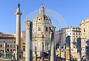 Trajan`s Column and Church of the Most Holy Name of Mary at Trajan Forum in Rome, Italy