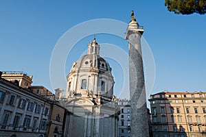 Trajan`s Roman triumphal Column and Santa Maria di Loreto church in Rome, Italy