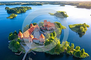 Trakai castle in Lithuania aerial view. Old castle with towers on island in lake. Amazing drone view on Trakai