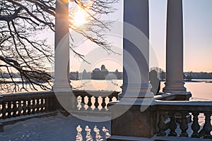 Trakai, LIthuania 2019-01-23, Galves lake, woman looking at the castle. View to Trakai castle from Uzutrakis mano, very beautiful