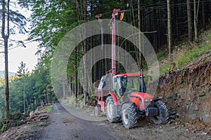 Traktor and forest cableway for timber concentration uphill, downhill on beskid mountains