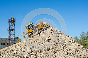 Traktor on the mine of white clay