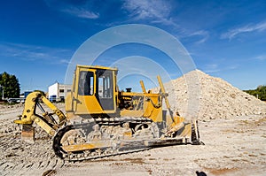 Traktor on the mine of white clay