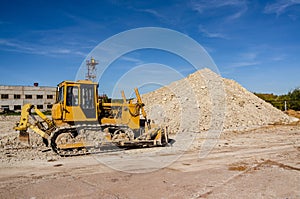 Traktor on the mine of white clay